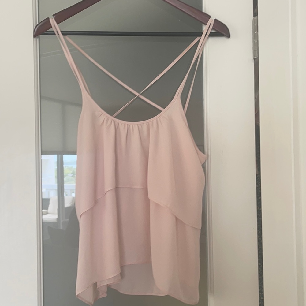 Light pink ruffle spaghetti strap camisole. Size M